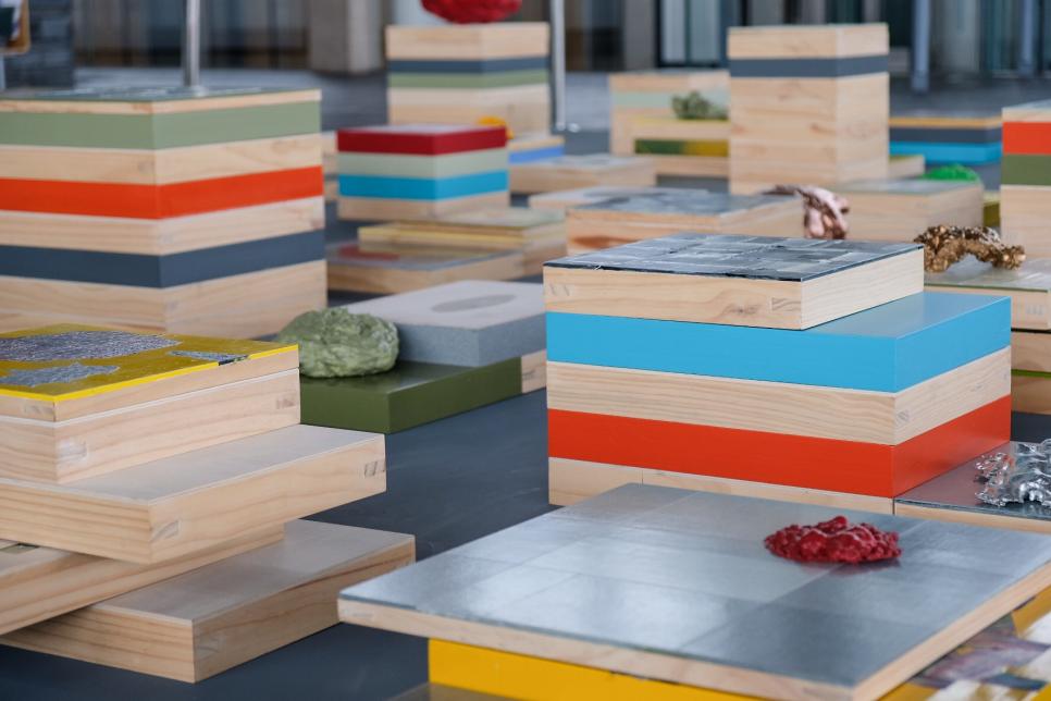 Colourful stacked boxes and objects displayed at Y Senedd